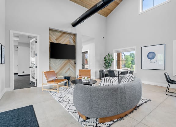 a living room with a couch and a tv