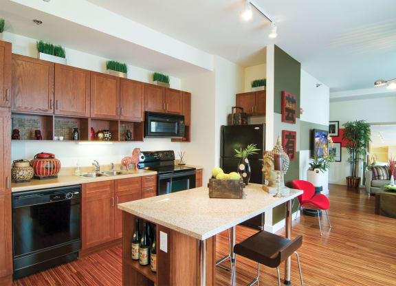 a kitchen and living room with a marble counter top
