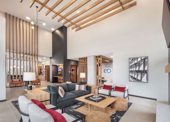 a living room with a couch and chairs and a table