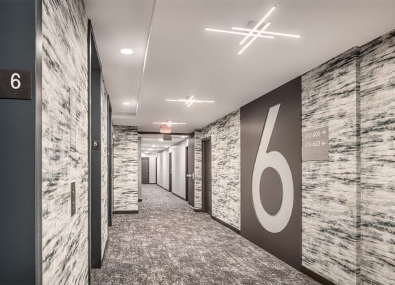 a hallway with a large number on the wall in a office