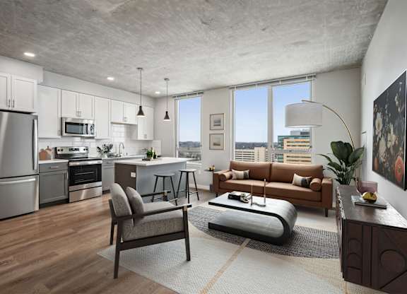 A modern kitchen with a refrigerator, oven, and microwave.