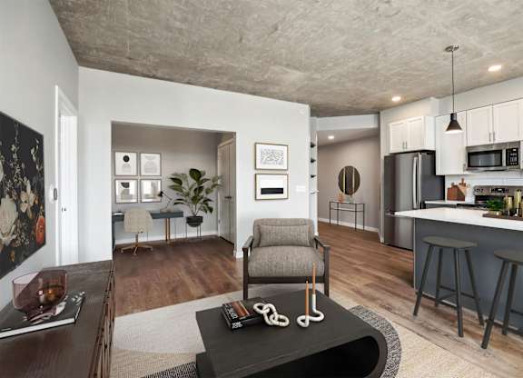 A modern living room with a grey armchair and a coffee table in the center.