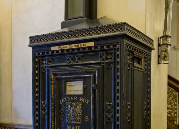 an old mail box on the side of a building