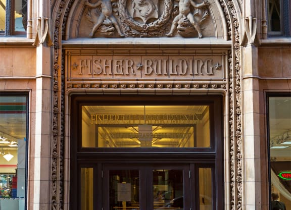 the entrance to the fisher building in the city
