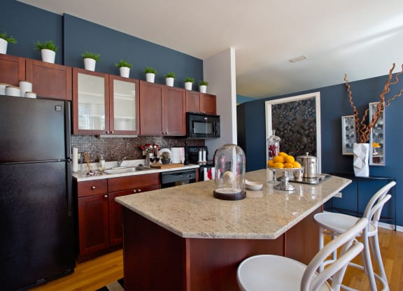 a kitchen with a counter top and a refrigerator