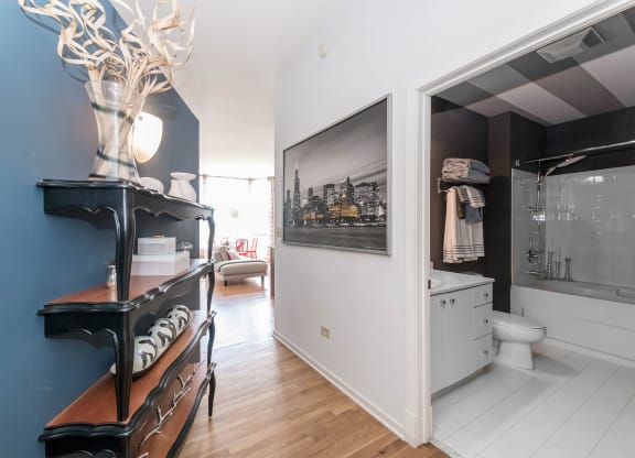 a bathroom with a blue wall and a black cabinet