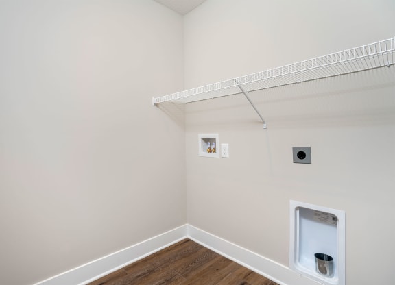 a white room with a closet and a toilet in it