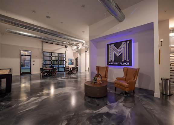A spacious room with a Harley Place sign on the wall.