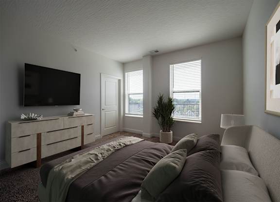 A modern bedroom with a large bed and a flat screen TV.