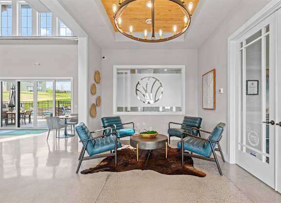 A modern living room with a large window and a view of the outside.