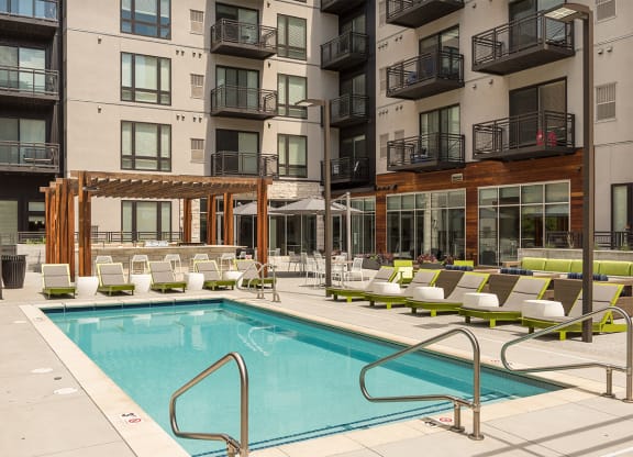 a swimming pool in the middle of an apartment building