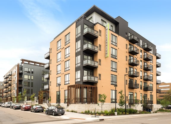 a rendering of an apartment building on a city street