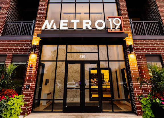 The entrance to a building with the sign Metro 19.