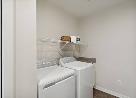 A laundry room with a washer and dryer.