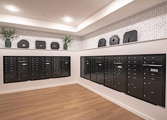 a lockers room in a house with a wood floor and a wall with speakers