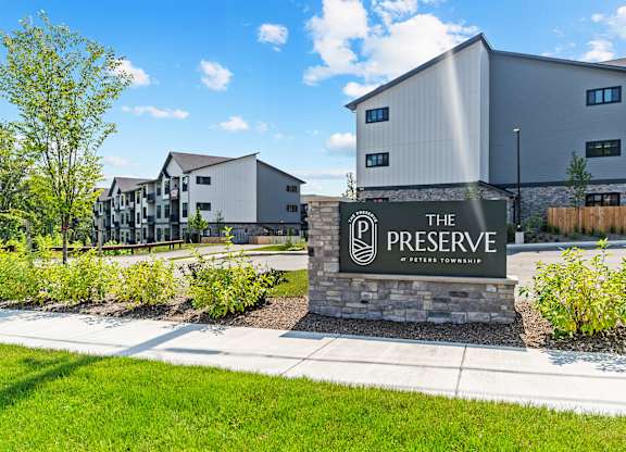The Preserve at Peterson Township is a modern building complex with a welcoming entrance sign.