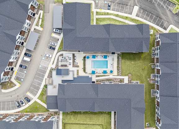 A large building with a pool in the middle of it.