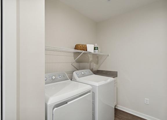 A laundry room with a washer and dryer.
