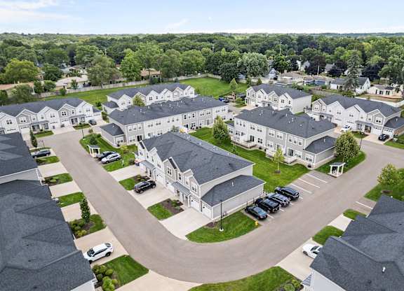 A large, well-maintained residential complex with multiple houses and a central courtyard.