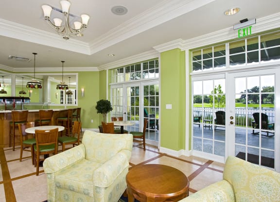 a living room filled with furniture and a large window at Arbor Oaks at Lakeland Hills, Florida, 33805