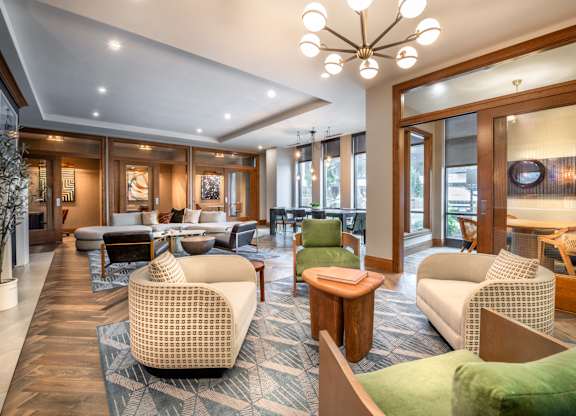 a living room with couches and chairs and a fireplace