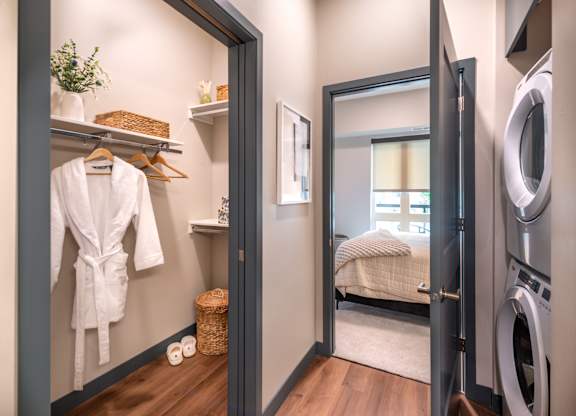 a small laundry room with a washer and dryer and a door to a