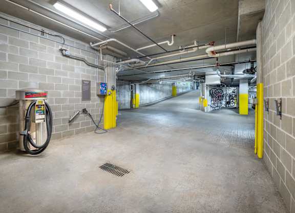 the inside of a parking garage with gasoline pumps