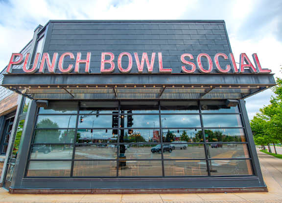 the front of punch bowl social with a large glass window
