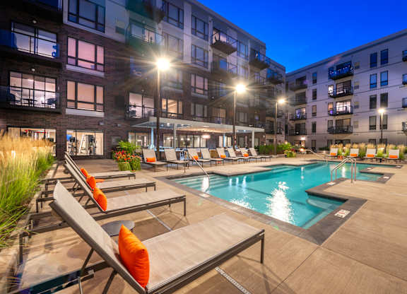 the residence apartment building swimming pool at night