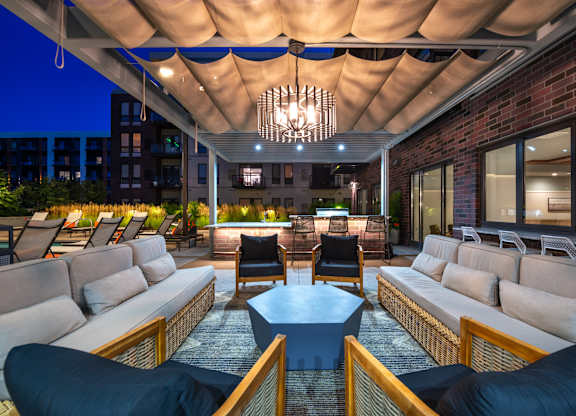 a lounge area with couches and chairs and a coffee table