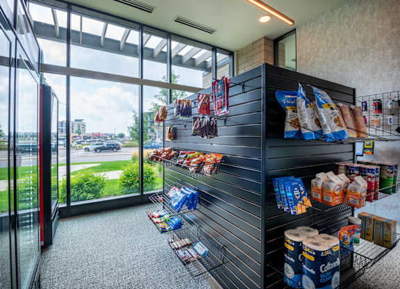 a store with a display of food in front of a window