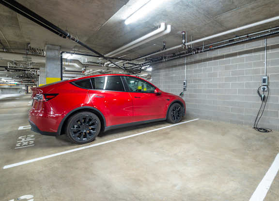 a red car parked in a parking garage