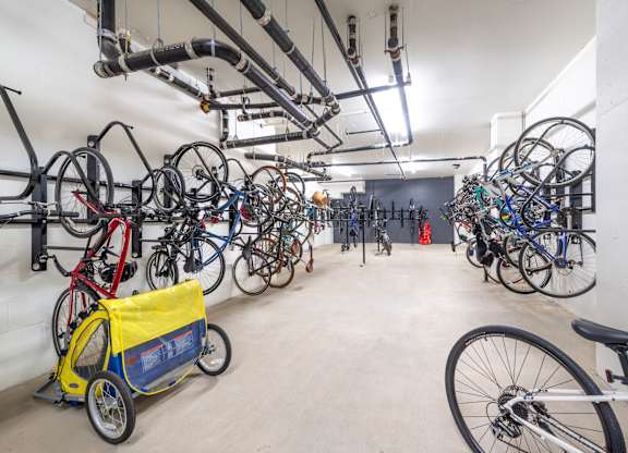 a large room filled with many bikes on the wall
