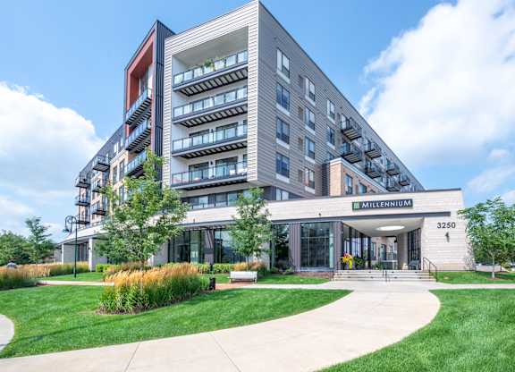 a rendering of an apartment building with four triangles on top of it