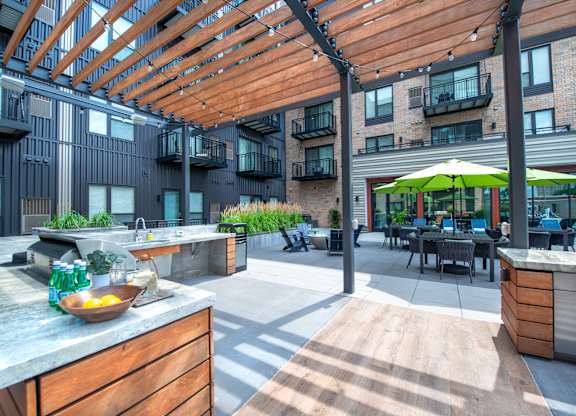 a rendering of a large lobby with tables and chairs