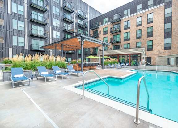 our apartments have a large pool and lounge chairs