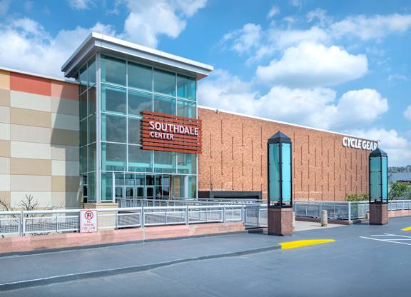the exterior of a convention center with a sign on the side of the building