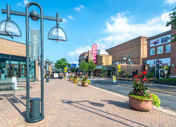 a city street with a street light on the side of a road