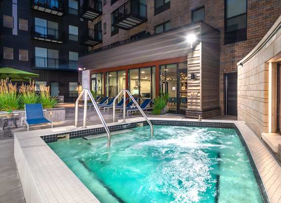 a swimming pool in a building with a hot tub