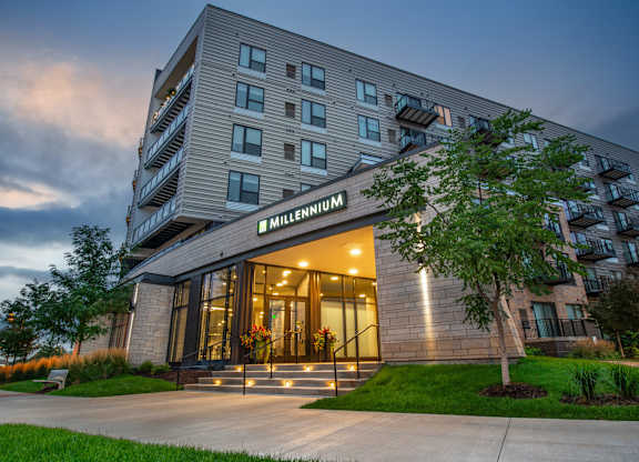 an exterior view of a hotel building at dusk