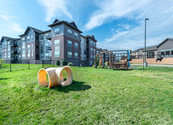 the preserve at ballantyne commons park with playground and apartment buildings
