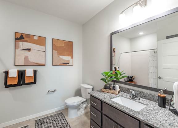 a view of a bathroom with a large geometric design on the wall
