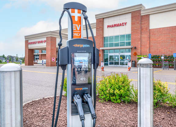 a gas pump in front of a store