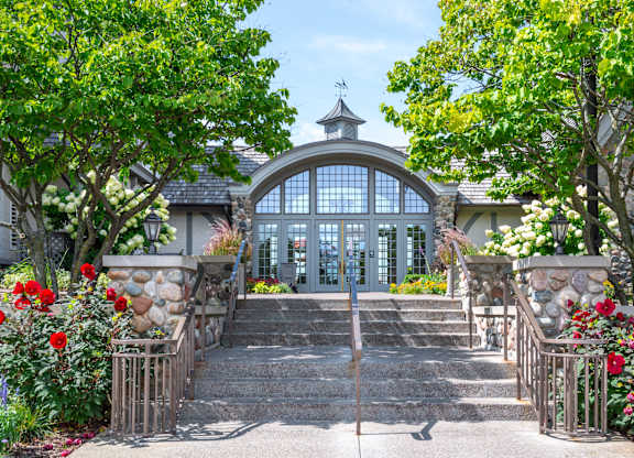 the entrance to a house with a staircase and a large glass door