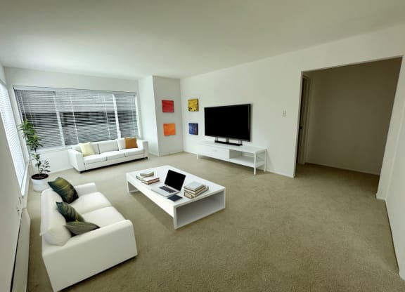 a living room filled with furniture and a flat screen tv