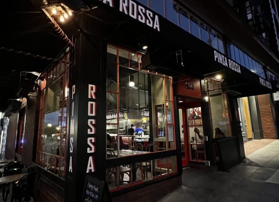 a view of the front of the restaurant at night