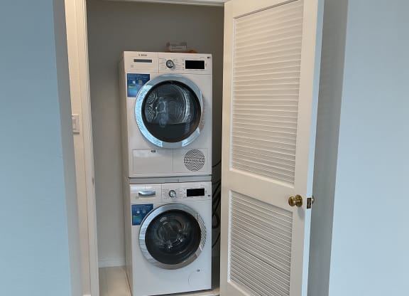 a small laundry room with a washer and dryer