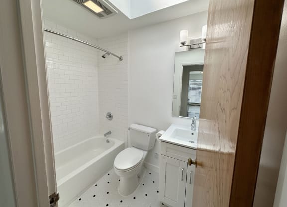 a bathroom with a toilet sink and bathtub
