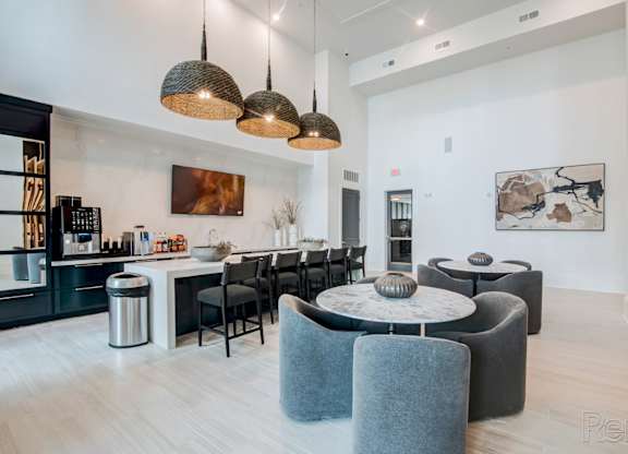 clubhouse and resident social lounge with full kitchen at Tapestry Nona Apartments in Orlando, FL