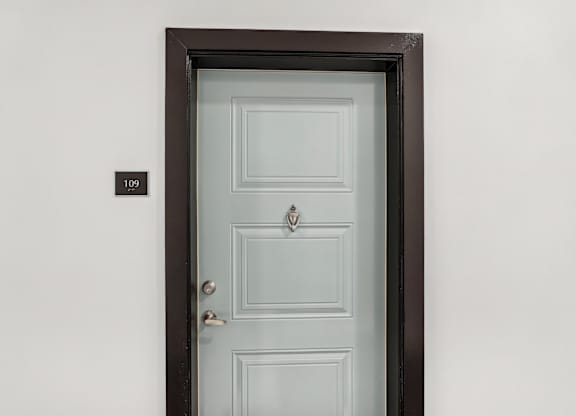 Front door of an apartment at Tapestry University Park apartments in Sarasota, FL
